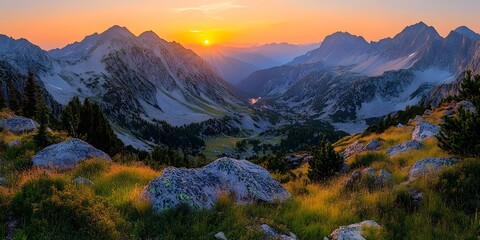 Obraz premium A breathtaking panoramic view of a mountain valley at sunrise, showcasing vibrant colors and dramatic peaks, evoking a sense of peace and adventure.