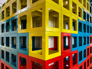 A vibrant display of interlocking colorful square structures showcases innovative design and geometric play, perfect for creative projects and modern art..