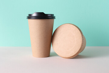 Eco cardboard round food box and craft hot drink cup, mint green background