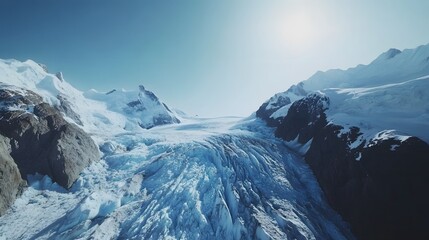 57. A stunning view of a glacier with deep blue ice and surrounding mountains under a clear sky