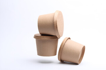 Eco cardboard round food boxes floating on white background