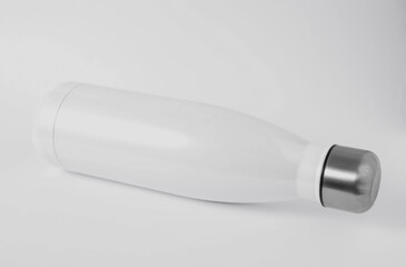 Mockup of white thermo bottle on white background