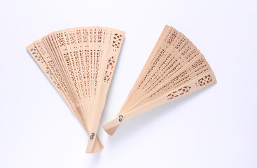 Traditional wooden Asian hand fans on white background