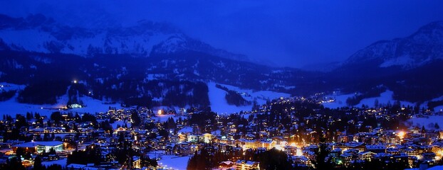 Night landscape of the town of Cortina d'Ampezzo in winter. Cortina d'Ampezzo, Belluno, Italy