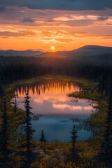 Fototapeta premium A breathtaking view of a serene lake surrounded by evergreen trees at sunset, showcasing vibrant colors reflecting on the water's surface.