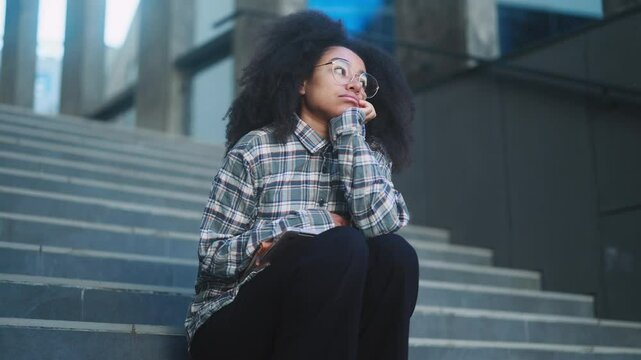 Tired exhausted boring young woman freelancer student with smartphone dozing while remembered about incredible news promotion sale interesting education app or website near university outdoors