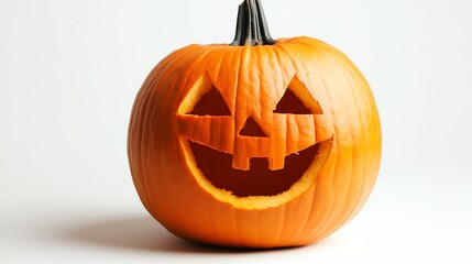 A carved pumpkin with a friendly face sits on a white background. The pumpkin is orange and has a rough texture.
