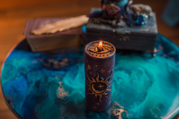 Negative energy is burning out. Mystical scene for esoteric content, candle is burning, flame. Fate and prediction 