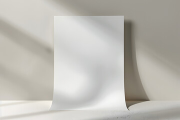 Blank sheet of paper resting on a textured surface with soft shadows creating a minimalist artistic effect in natural light