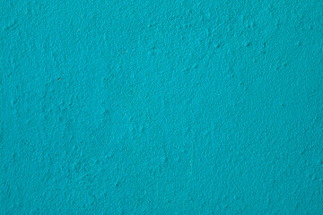 Empty turquoise wall background for texts. Cement texture.