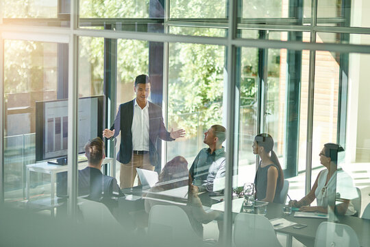 Business, team and tech in boardroom for presentation, brand management or feedback chart. Man speaker, people or corporate workshop in office for company growth, strategy or group performance review