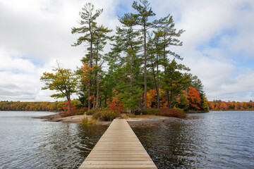 Wooden Bridge to Island on Hardy Lake in Muskoka, Canada.