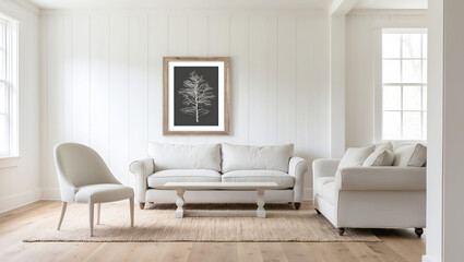 Bright living room with white sofa, armchair, and framed art, minimalist decor