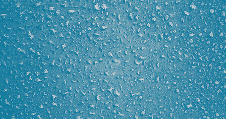 Blue Water drops on surface. Water droplets on background. Water droplets concept. Water drops on a background. Banner with raindrops.