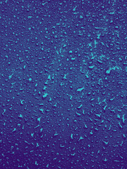 Blue Water drops on surface. Water droplets on background. Water droplets concept. Water drops on a background. Banner with raindrops.