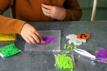 Halloween creative leisure, hand bead zoom view child hand neon color ironing bead