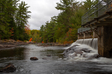 Bridge spanning river along hiking trail at Wilson Falls.