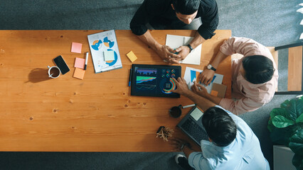 Executive manager explain financial graph to colleague at meeting room. Top aerial view of diverse...