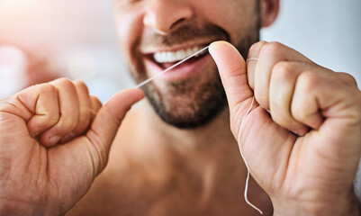 Hands, face and man floss teeth for smile, dental health and care for gum gingivitis at home....