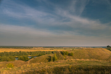 Fototapeta premium A beautiful landscape with a river and a hill