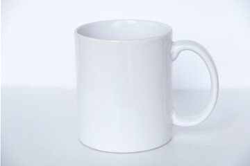 Elegant white ceramic mug isolated on a blank background, suitable for product marketing, mockups, and graphic design