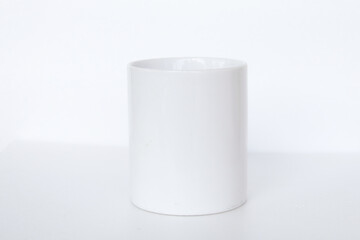 Elegant white ceramic mug isolated on a blank background, suitable for product marketing, mockups, and graphic design