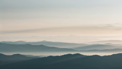 Obraz premium Serene Mountain Range at Sunrise with Soft Light and Shadows