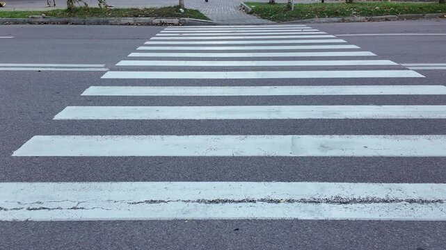 Pedestrian crossing at city street in the daytime, background
