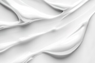 Fototapeta premium White cosmetic cream background, close-up of a white skincare product texture with smooth lines