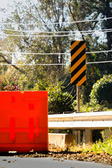 Plastic Jersey Barrier and Caution Hash Mark Sign