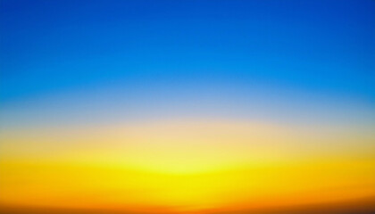 Obraz premium Witness the breathtaking spectacle of a vibrant sunset, where fiery oranges and yellows meet a tranquil blue sky, creating a mesmerizing gradient of color. A peaceful scene.