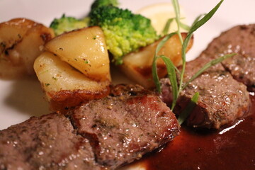 Ukrainian cuisine: shashlik (marinated and grilled lamb loin) with Georgian tomato and plum sauce