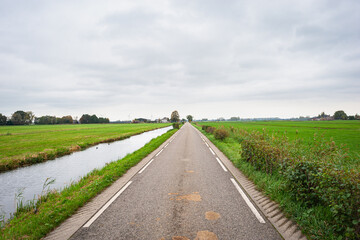 Countryroad in low lying Zuidplas, The Netherlands. In the near future, the village Cortelande, first known as the fifth village, will be built here.