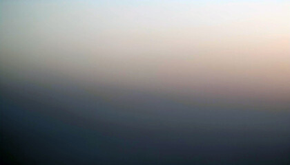 Fototapeta premium Subtle hues of dawn paint the sky, a tranquil gradient from deep blues to soft pinks and whites. A serene, misty atmosphere unfolds, promising a beautiful day.
