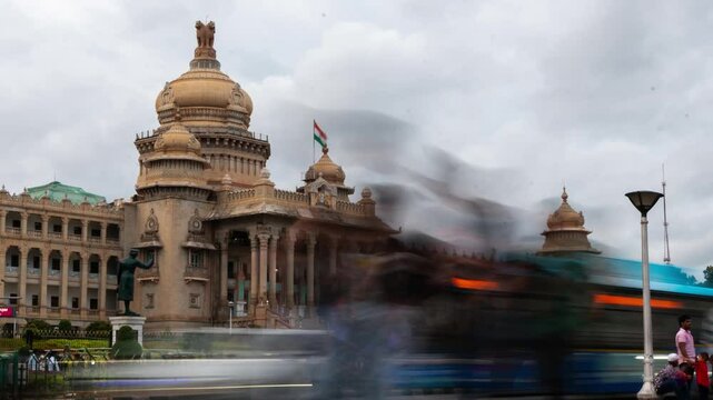 4K Hyper lapse time lapse footage of traffic and people in Bengaluru and the Vidhan Soudha legislative assembly as seen from Dr. B. R. Ambedkar Road