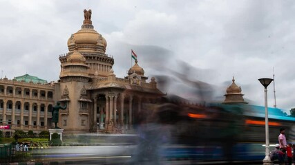 4K Hyper lapse time lapse footage of traffic and people in Bengaluru and the Vidhan Soudha legislative assembly as seen from Dr. B. R. Ambedkar Road