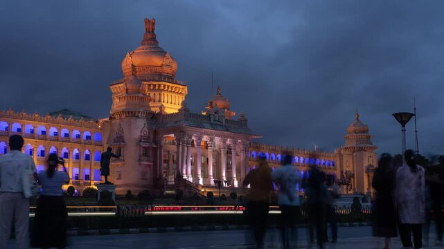 4K Hyper lapse time lapse footage of traffic and people in Bengaluru and the Vidhan Soudha legislative assembly as seen from Dr. B. R. Ambedkar Road