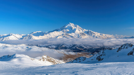 Obraz premium Snow covered mountain peaks rise majestically under clear blue sky