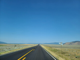 Scenic Open Road Through Golden Landscape