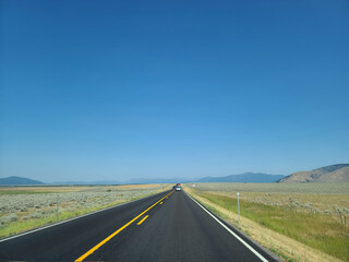 Scenic Open Road Through Golden Landscape