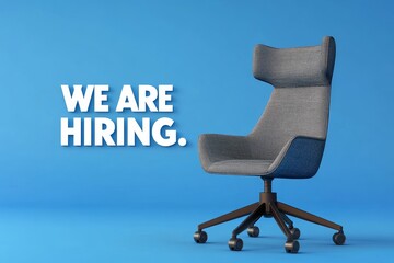 A stylish modern office chair beside a vibrant wall that announces we are hiring, inviting talent in a dynamic workspace