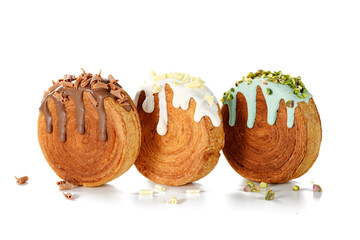 Round croissants with different  filling and glaze, trendy dessert. isolated on white background