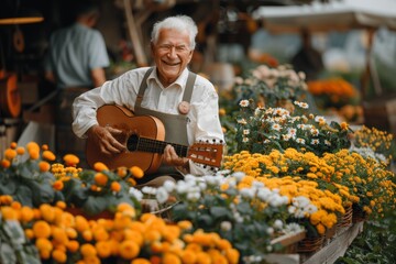 Elderly man playing guitar among vibrant flowers at a local market during the sunny afternoon