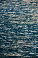 Textural waves at sunset in the sea