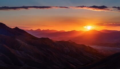 Fototapeta premium awe inspiring sunset casting orange glow over red and yellow mountains