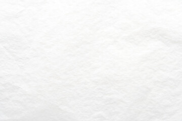 Textured white paper background with subtle creases and natural fibers for artistic and professional design projects.