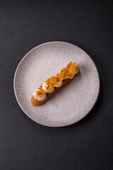 Sweet dessert eclairs or profiteroles with chocolate filling