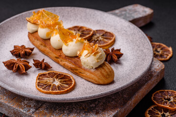 Sweet dessert eclairs or profiteroles with chocolate filling