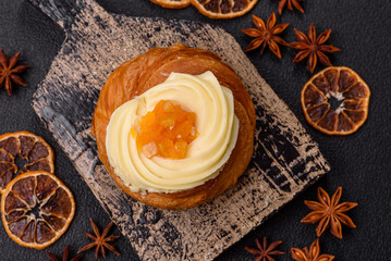 Sweet dessert danish with raisins, cream and pear filling