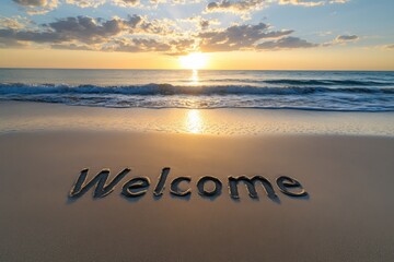 Welcome written in the sand as the sun sets over a tranquil beach